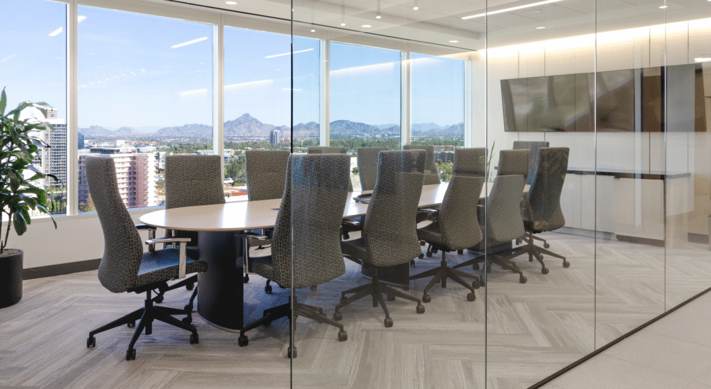 The firm’s conference room in Midtown Phoenix, with the city and the mountains through the windows